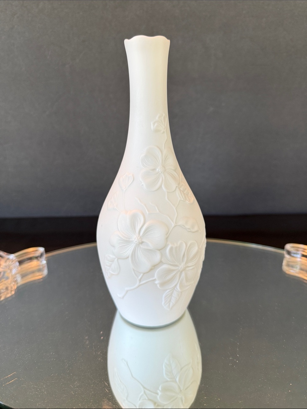 AK Kaiser White Bisque Porcelain Bud Vase featuring an embossed floral design.